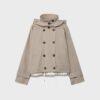 Kurzes Trenchcoat mit Puffärmeln und abnehmbarer Kapuze Kurzes Trenchcoat mit Puffärmeln und abnehmbarer Kapuze